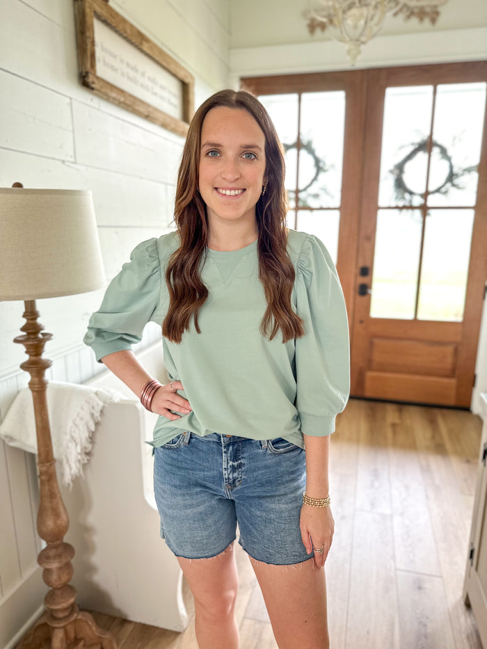 tamyrn top in aloe green color paired with denim dear john shorts