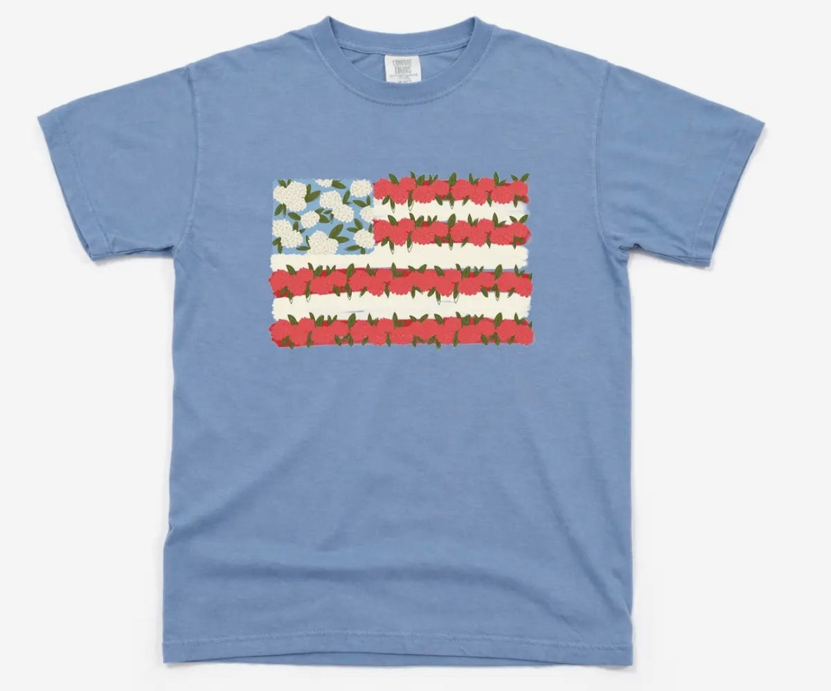 Blue t-shirt with a floral American flag design on a white background