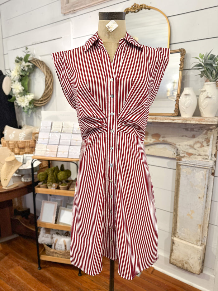 Red and white striped dress on a mannequin in a store setting.