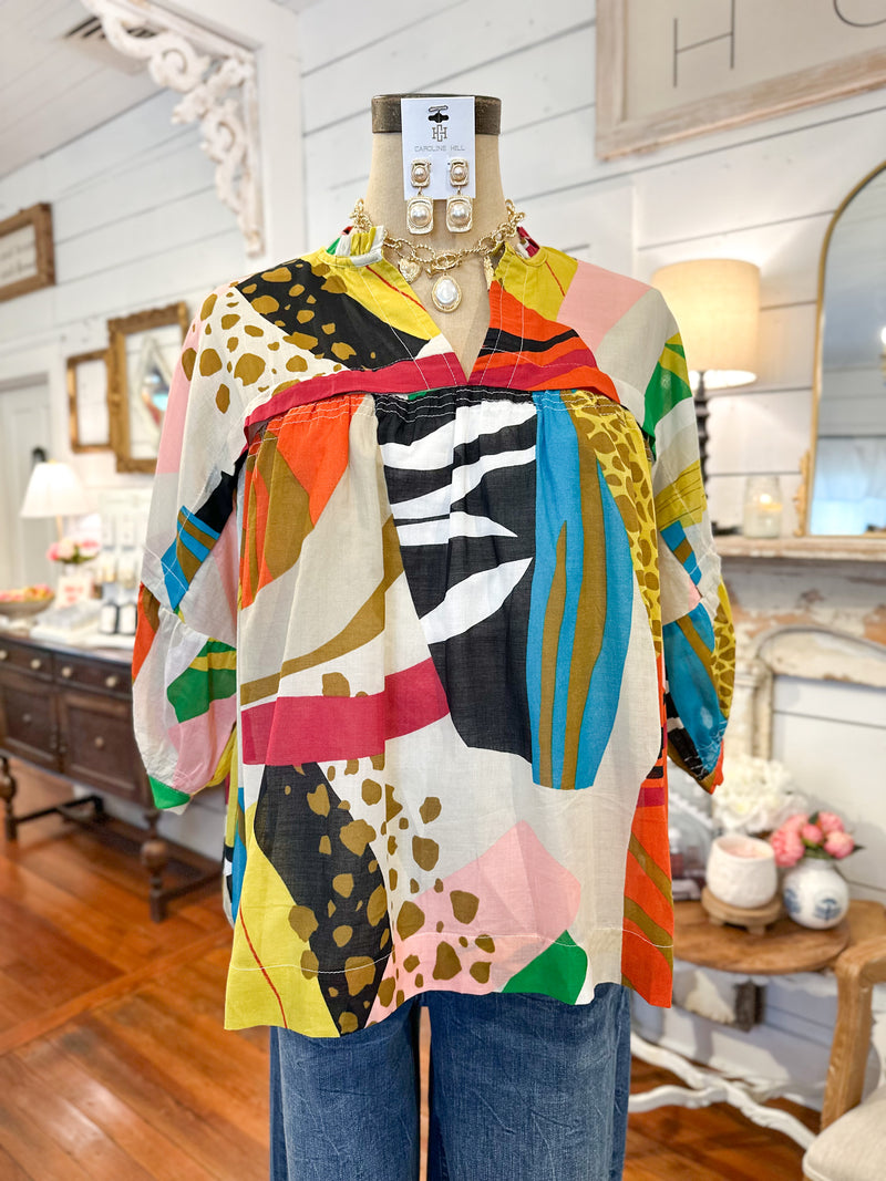 Colorful patterned shirt on a mannequin inside boutique