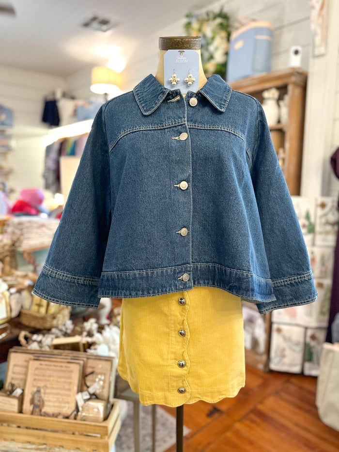 mustard yellow skirt with denim cape 
