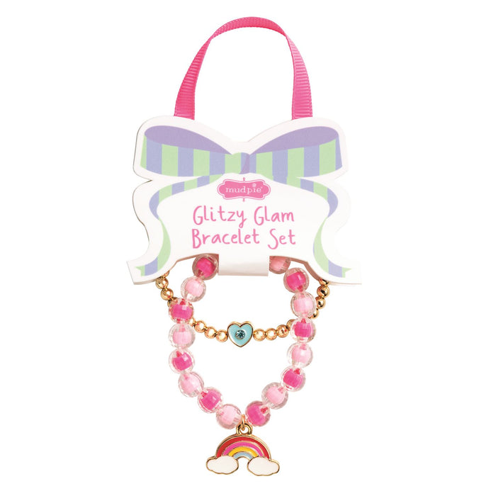 Glitzy Glam bracelet set with pink beads and rainbow charm on a white background