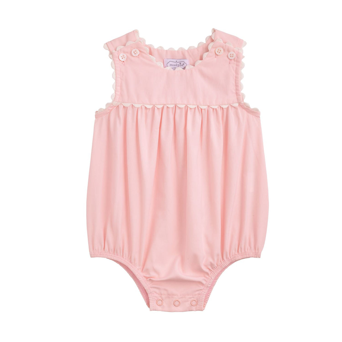 Pink baby romper with ruffled shoulders on a white background mud pie baby 
