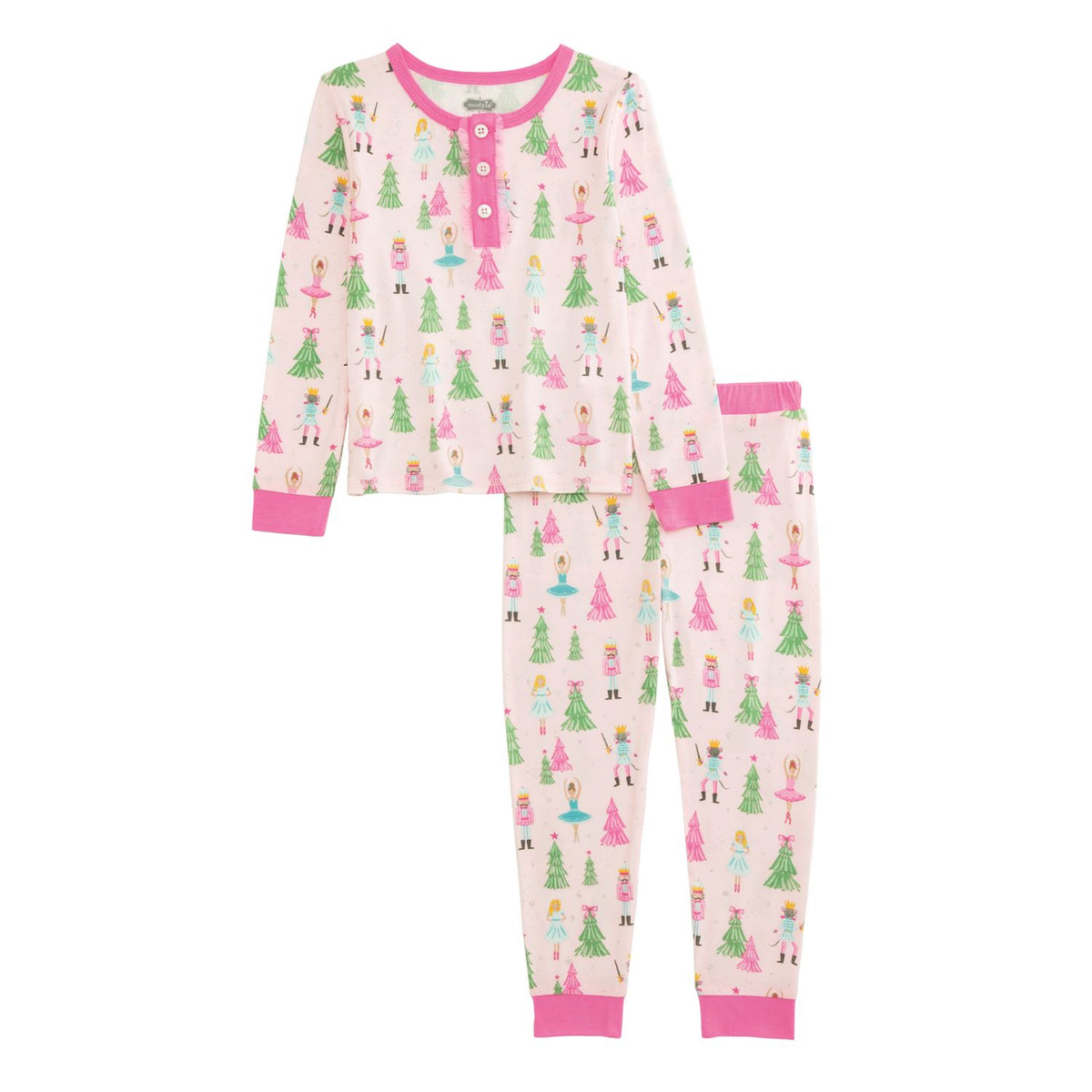 Children's pajama set with tree and nutcracker theme pattern on a white background