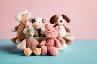Set of plush toys including a dog, cat, rabbit, and duck on a pink and blue gradient background.