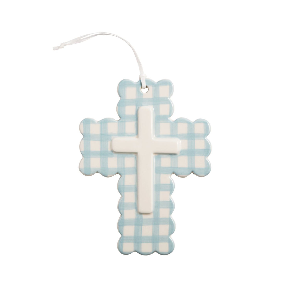 Decorative cross with blue and white checkered pattern on a white  mud pie background