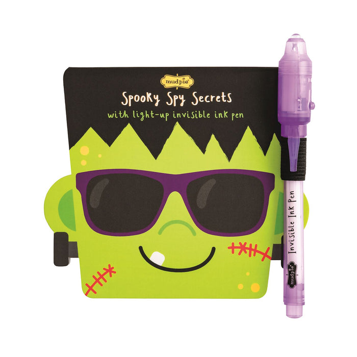 monster mud pie notebook with a light-up invisible ink pen on a white background