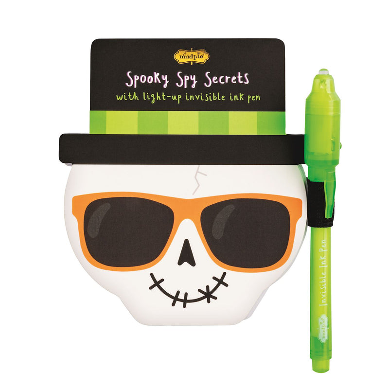 Halloween-themed notepad with a ghost design, sunglasses, and a green pen on a white background.