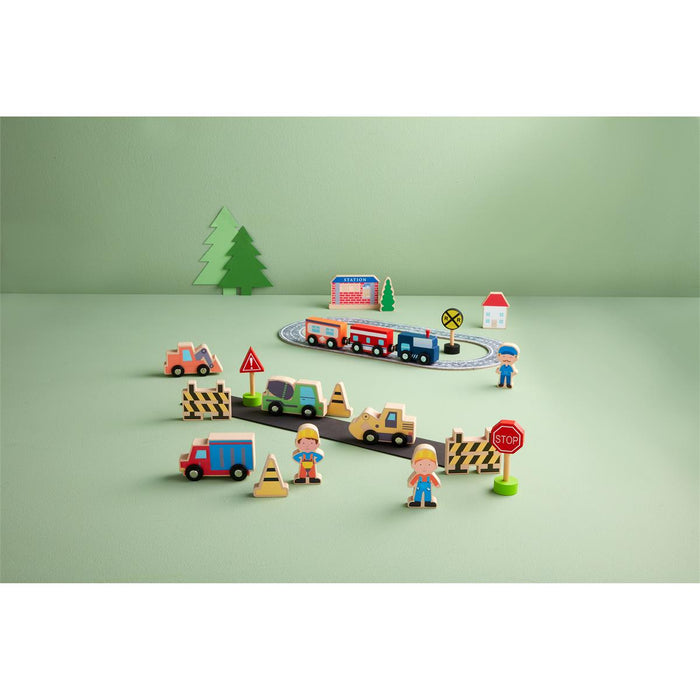 Toy construction set with vehicles and figures on a green surface