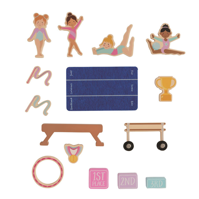 Gymnastics-themed paper cutouts including figures, equipment, and awards on a white background