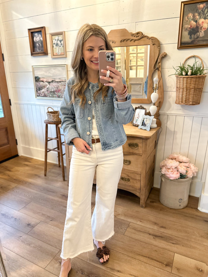 light wash denim jacket with silver buttons