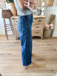 side view twist barrel jean dark wash 