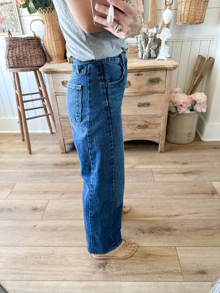 side view twist barrel jean dark wash 