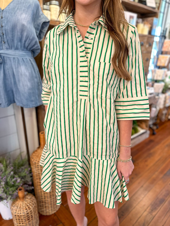 green stripe dress with ruffles along the hem