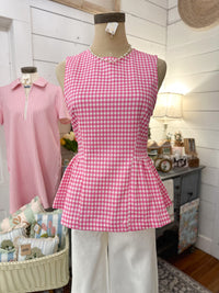 pink and white checkered peplum top with zipper on the back 