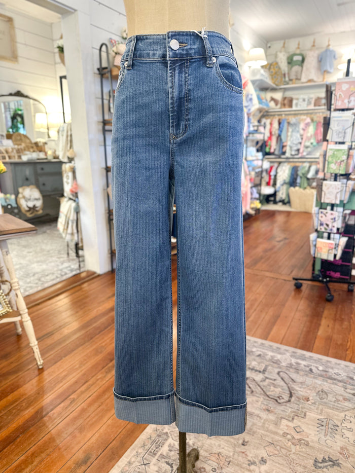 Blue jeans on a mannequin in a store setting holly dear john 
