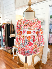 Floral dress on a mannequin in a store setting bubble for baby