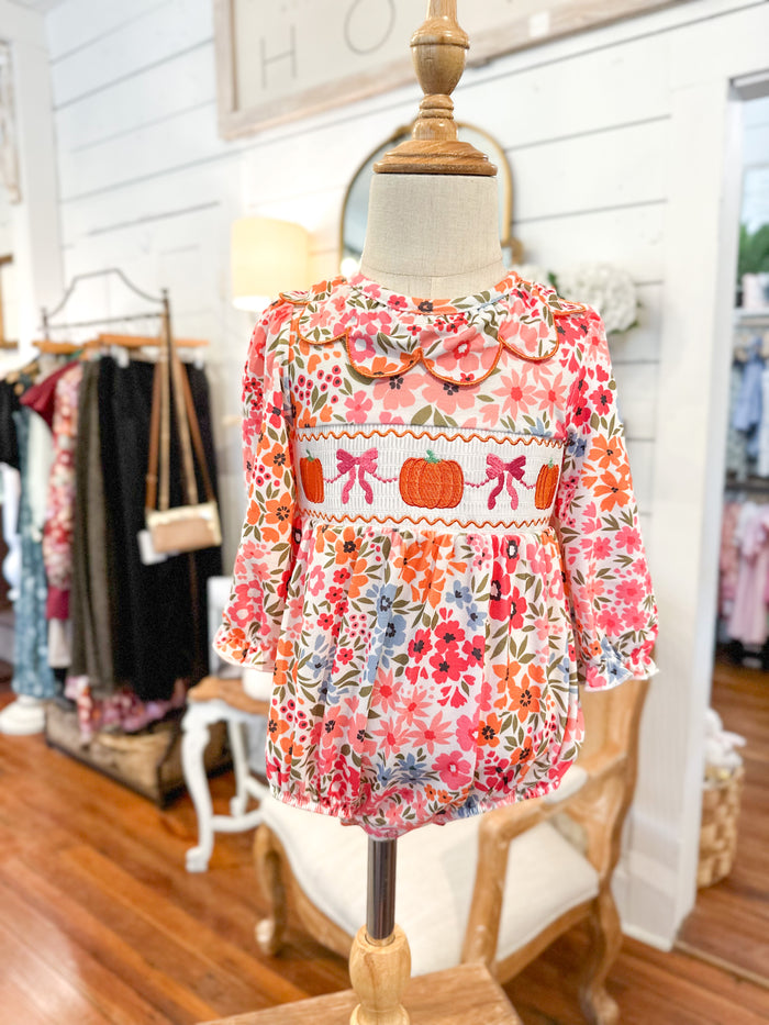 Floral dress on a mannequin in a store setting bubble for baby