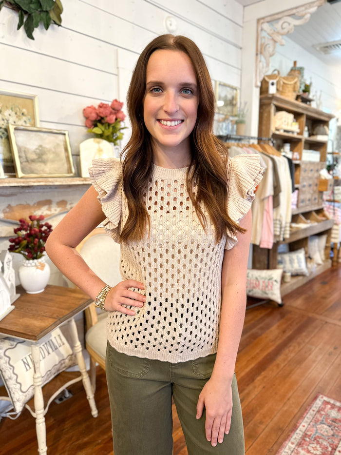 light tan knit sweater top with ruffle sleeves
