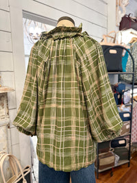 green plaid top umgee blouse inside  store setting back view 