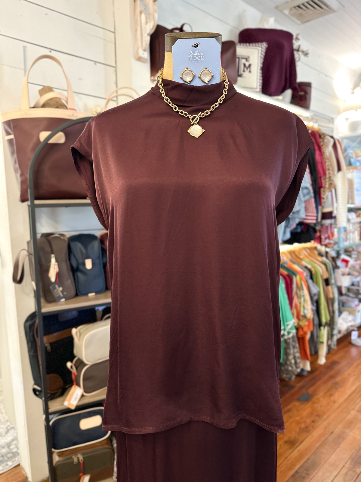 maroon silky soft sleeveless top 
