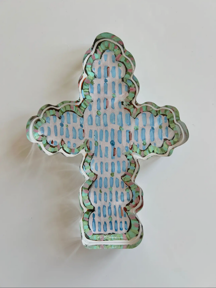 Decorative cross-shaped object with intricate patterns on a white background faithful cross 
