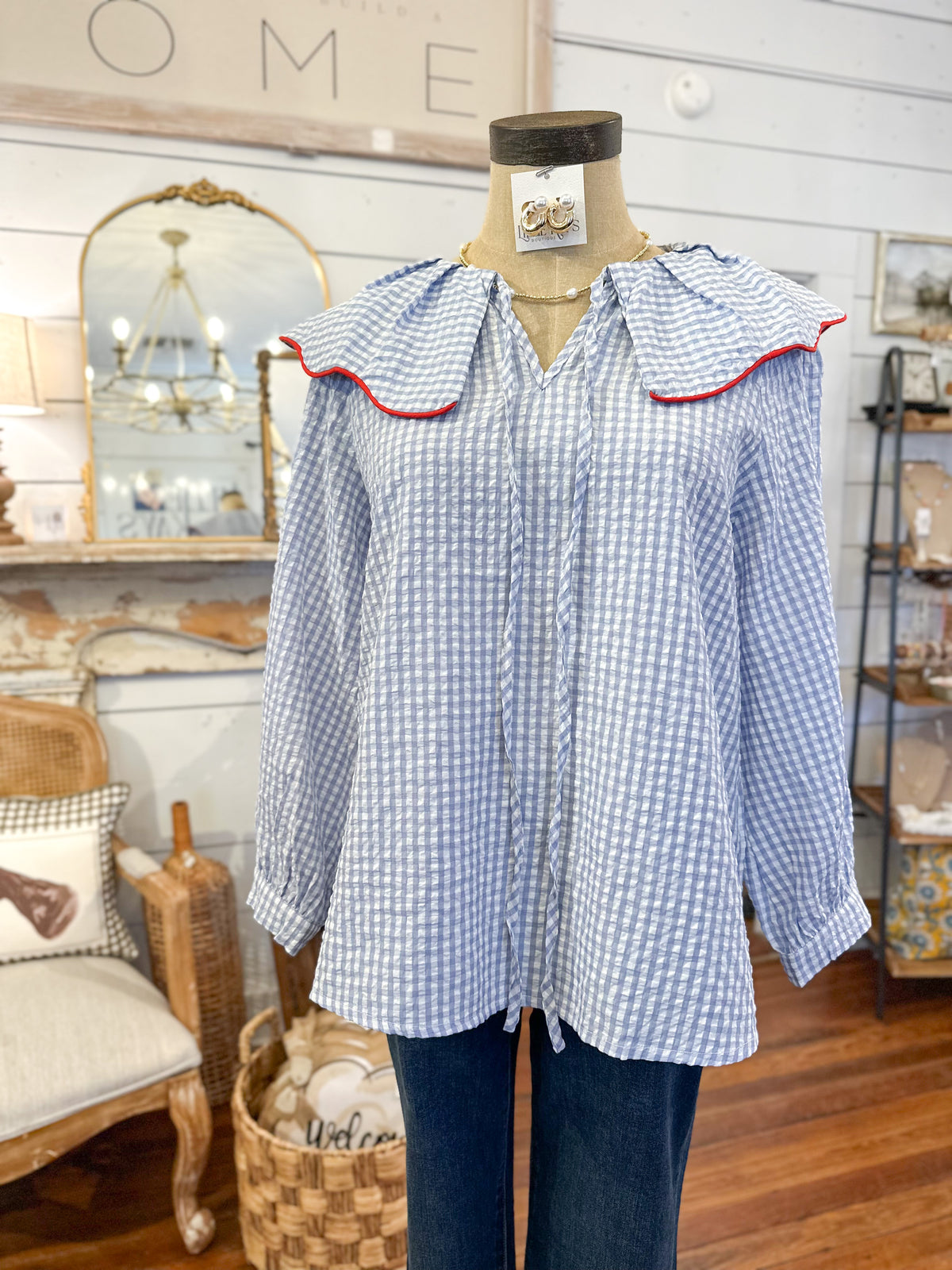 blue and white checkered blouse long sleeve with red trim on collar 