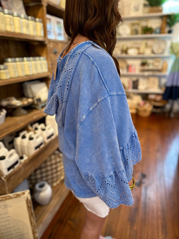 washed blue hooded top with eyelet lace details