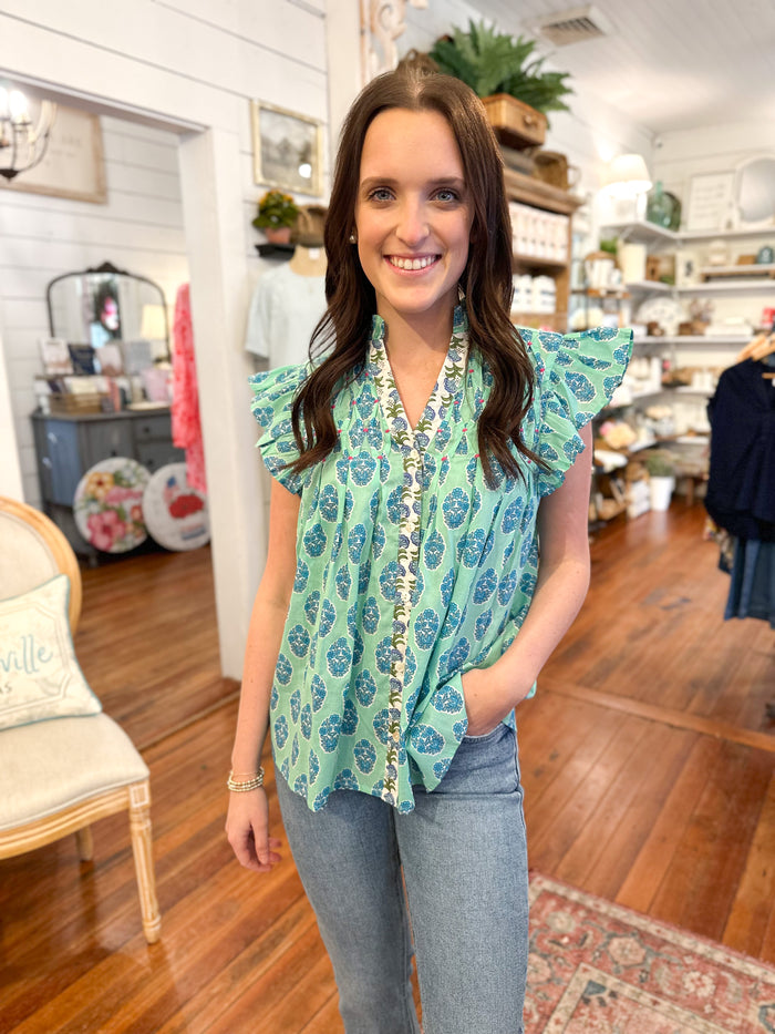 block print blue flutter sleeve blouse with buttons down the front thml