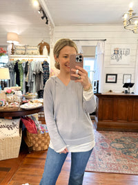 light grey hooded top with layered look 