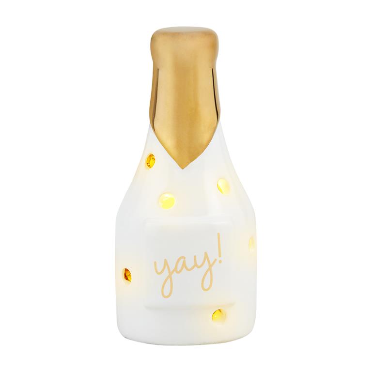 Decorative bottle-shaped light with gold top and 'yay!' text on a light up sitter on white background