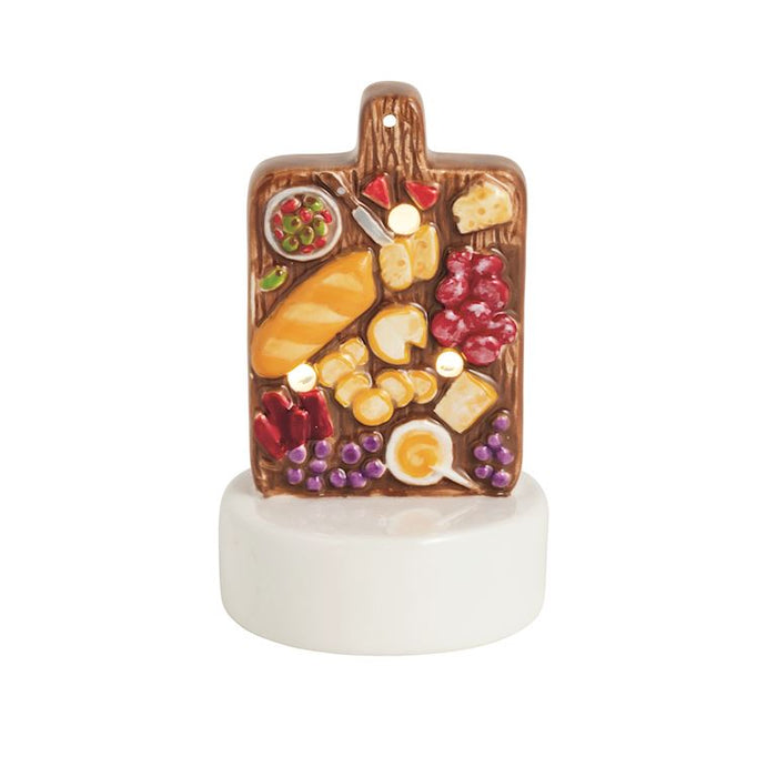 Decorative cutting board with food items light up sitter  on a white background