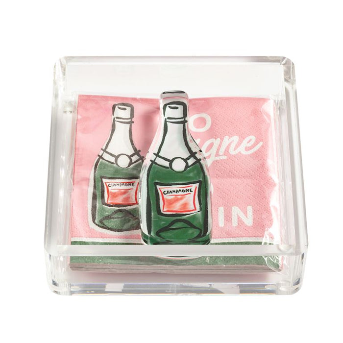 Pack of napkins with champagne bottle design in a clear holder on a white background mud pie 