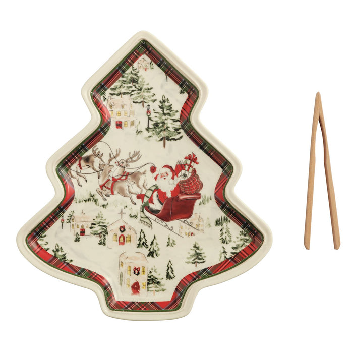Christmas-themed plate with Santa Claus and reindeer design, accompanied by a wooden tong.