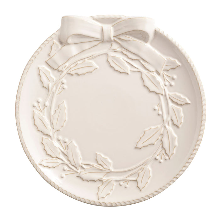 Decorative plate with wreath design and bow on a white background