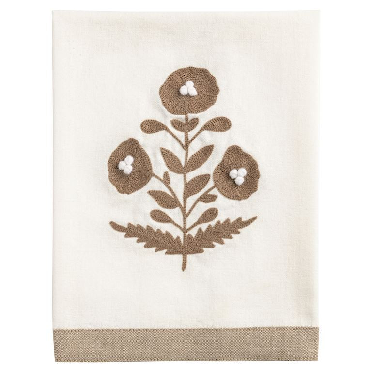 Decorative towel with brown floral pattern on a white background