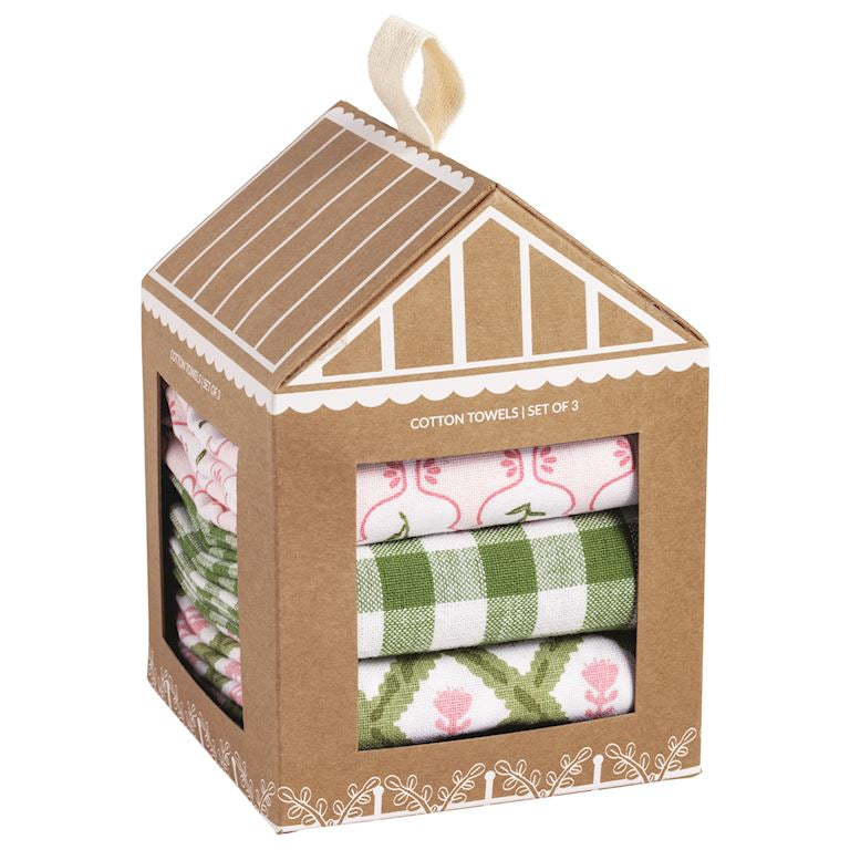Set of cotton towels in a decorative cardboard house-shaped box.