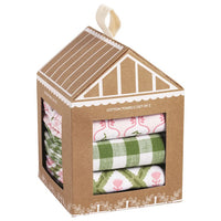 Set of cotton towels in a decorative cardboard house-shaped box.
