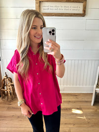 bright pink button down collared top