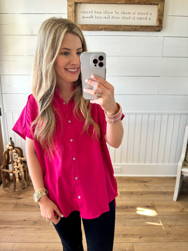 bright pink button down collared top