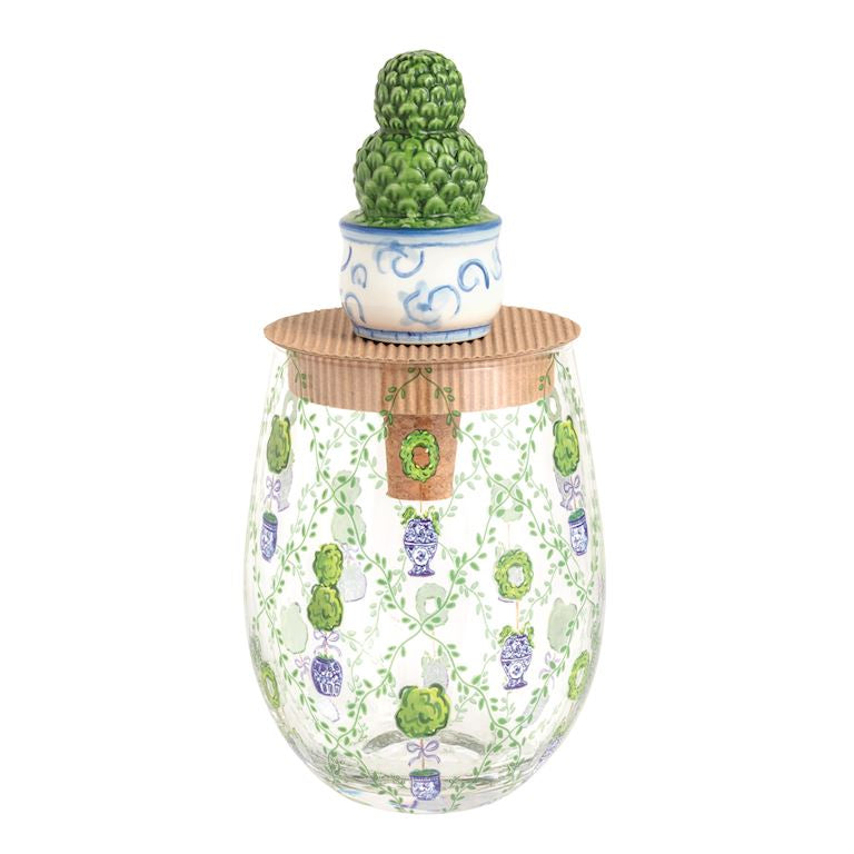 Decorative glass container with cactus design on a white background