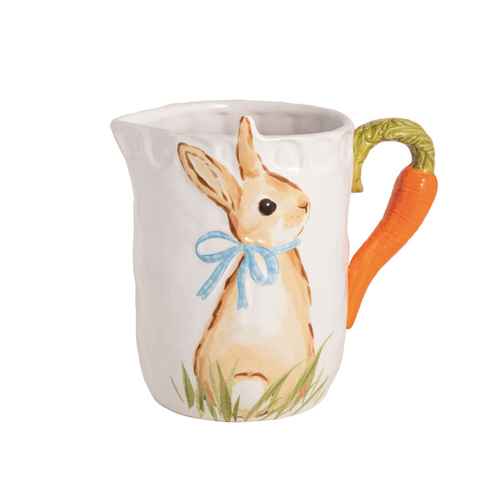 Ceramic pitcher with a rabbit design and carrot handle on a white background mud pie 