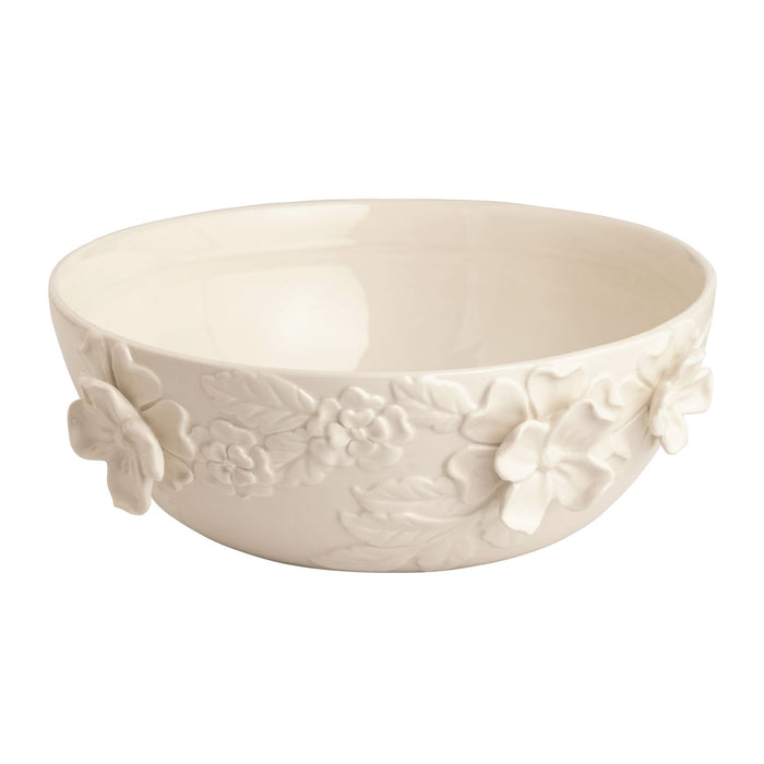 White ceramic bowl with floral embossing on a white background