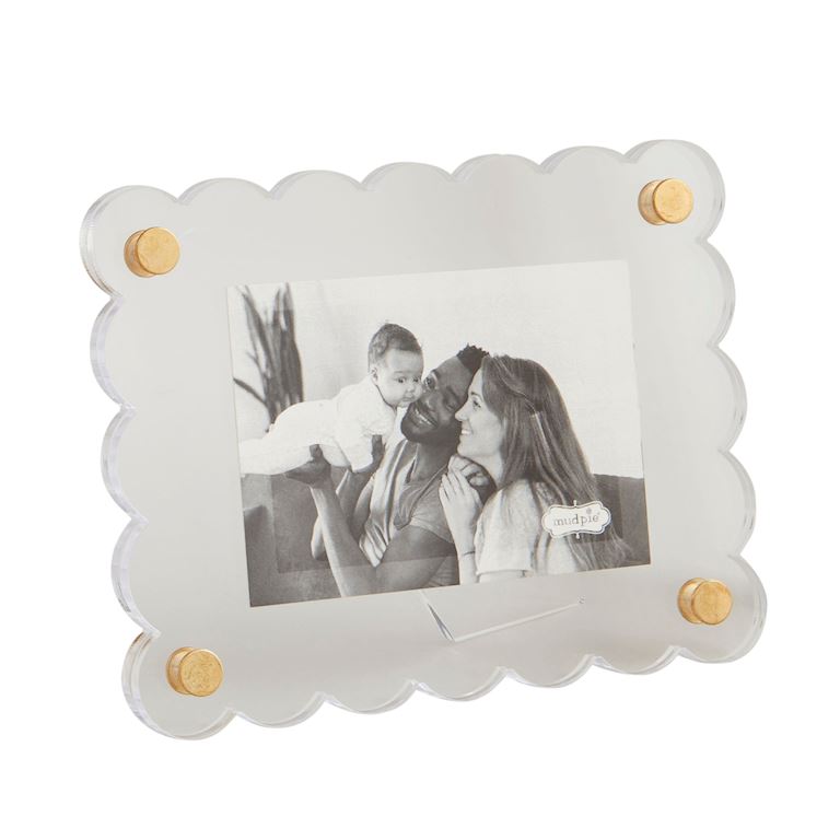 Decorative photo frame with scalloped edges and gold accents on a white background