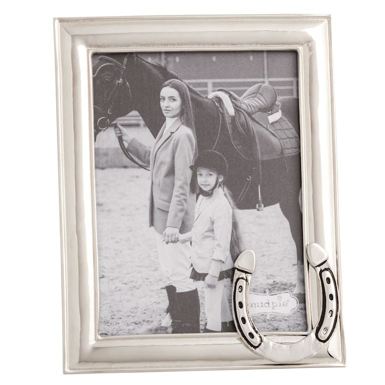Silver photo frame with a picture of a woman and child holding hands with a horse, featuring a horseshoe design.