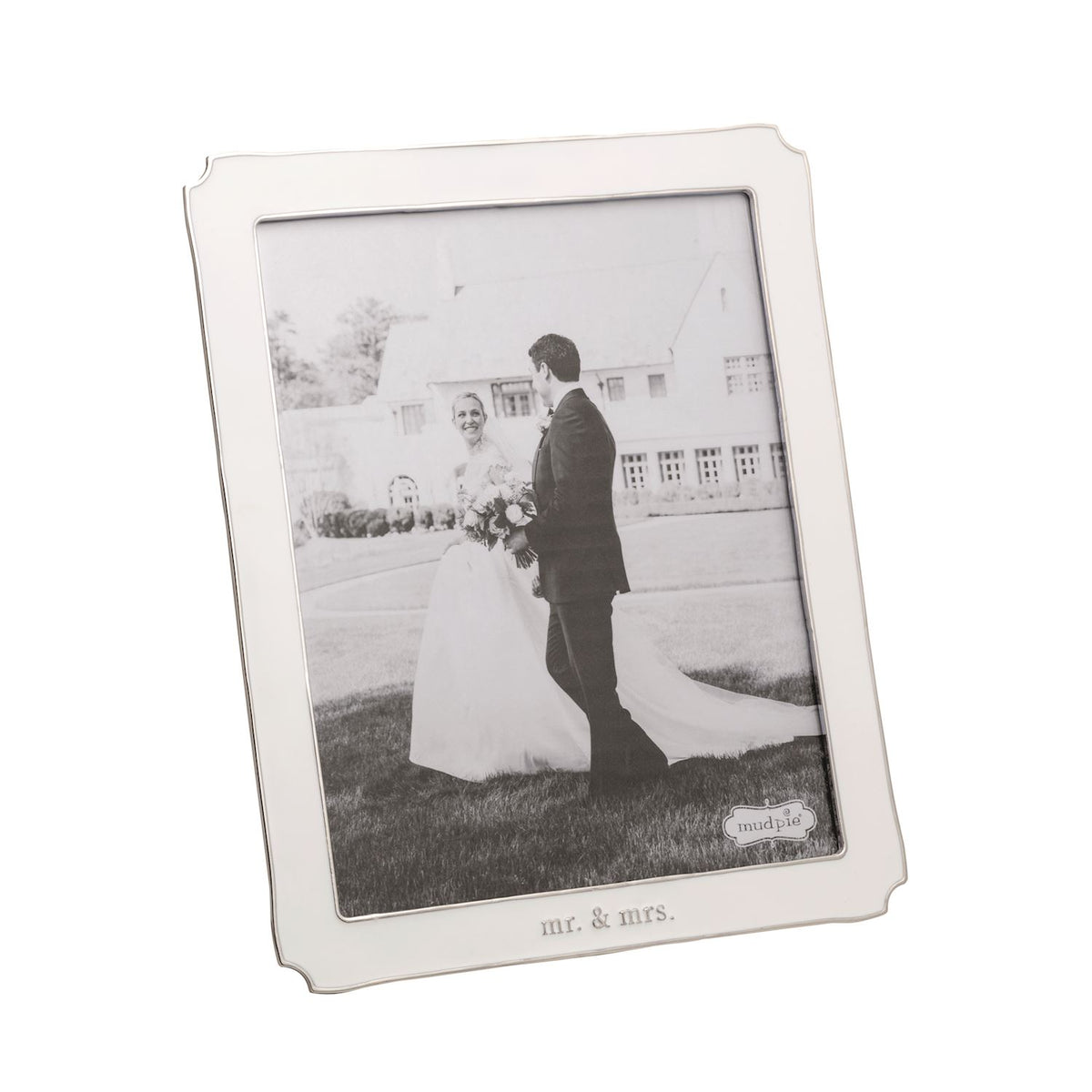 White enamel photo frame with a black and white photograph of a bride and groom.