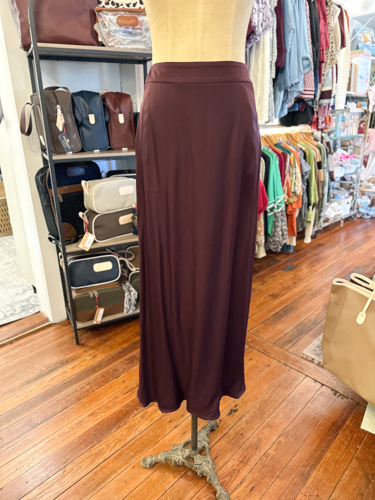 silky soft maroon skirt with pockets and zipper closure 
