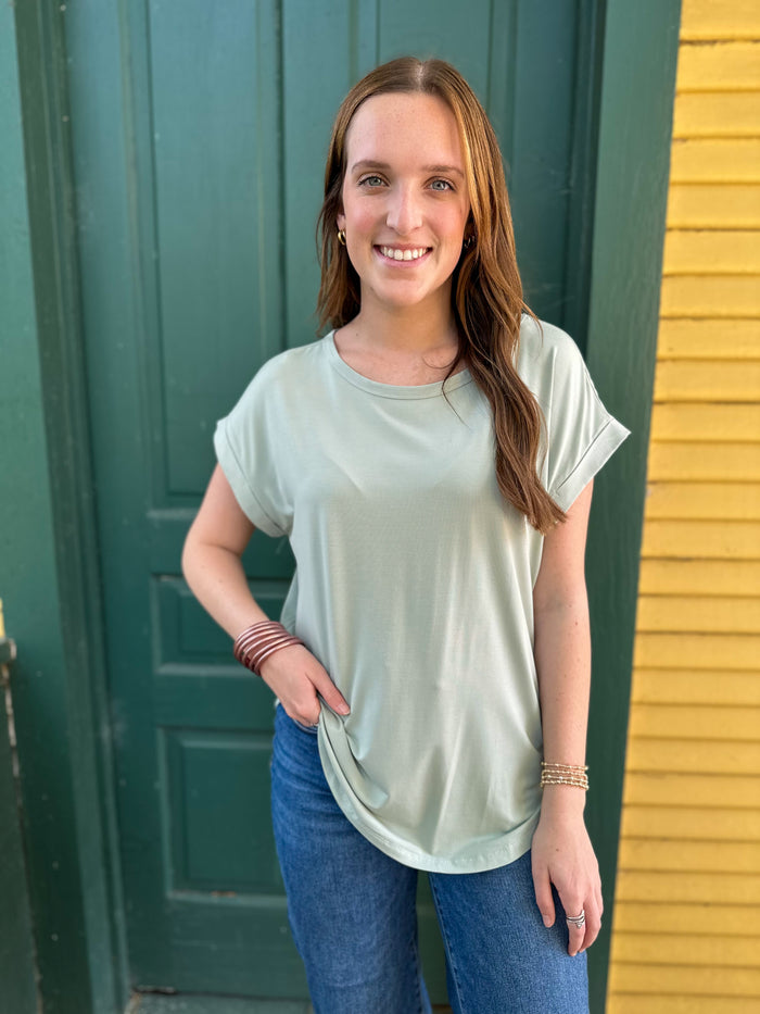 light sage green basic tee with rolled sleevs