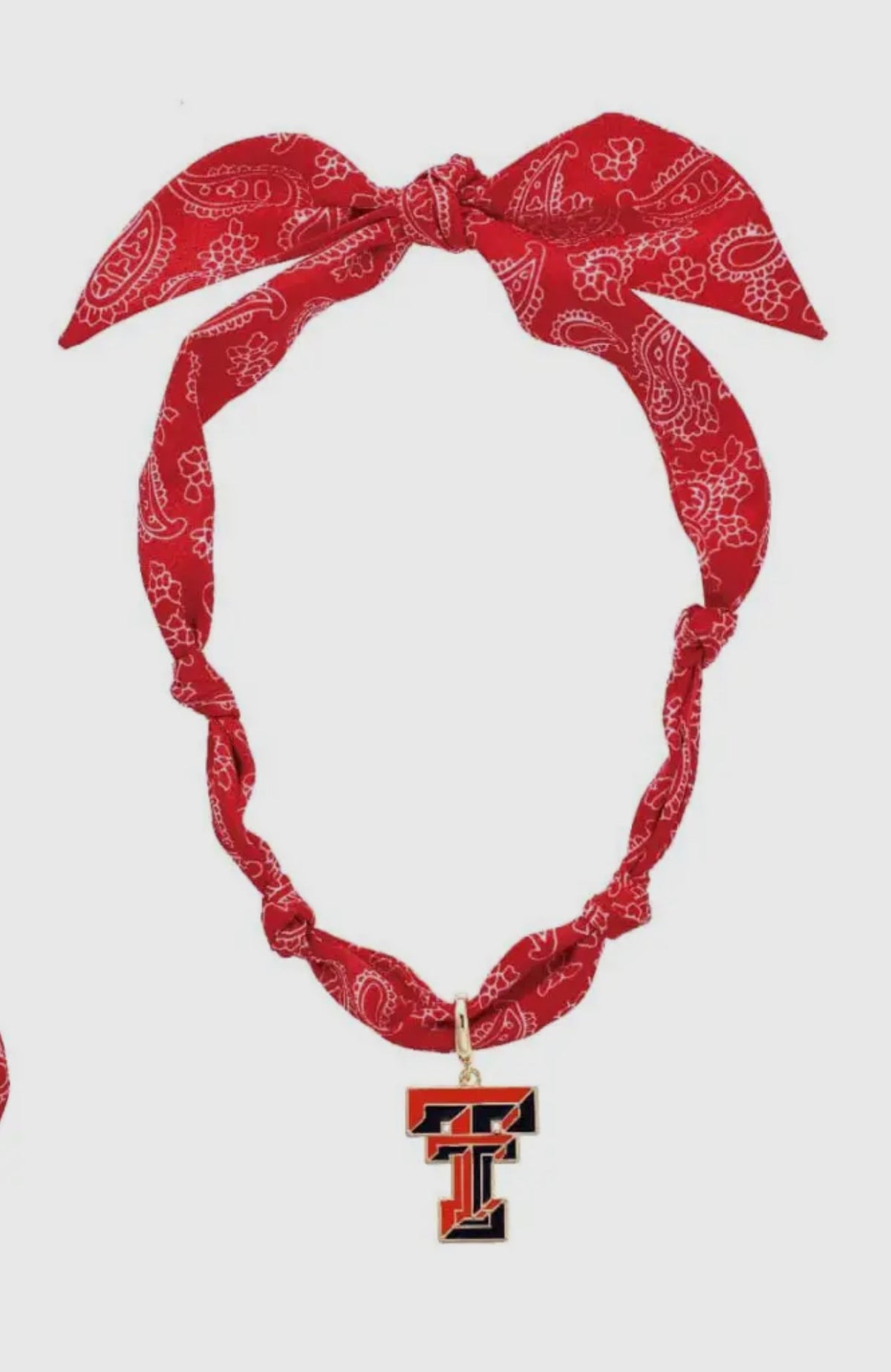 Red bandana headband with a pendant featuring a 'Texas Tech' on a white background