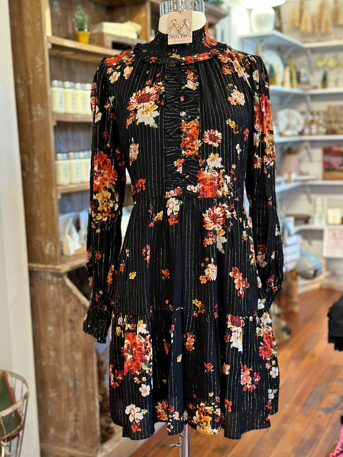 black dress with gold thread and flowers